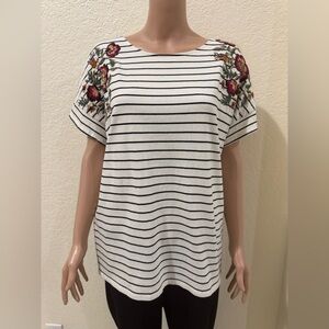 A cute striped t-shirt with a floral design on the shoulders from Chico’s!